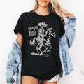 Graveyard Rodeo Cowboy Skeleton Cauldron Moonlit Night Parade Haunting Western Style Illustration Graphic Tee