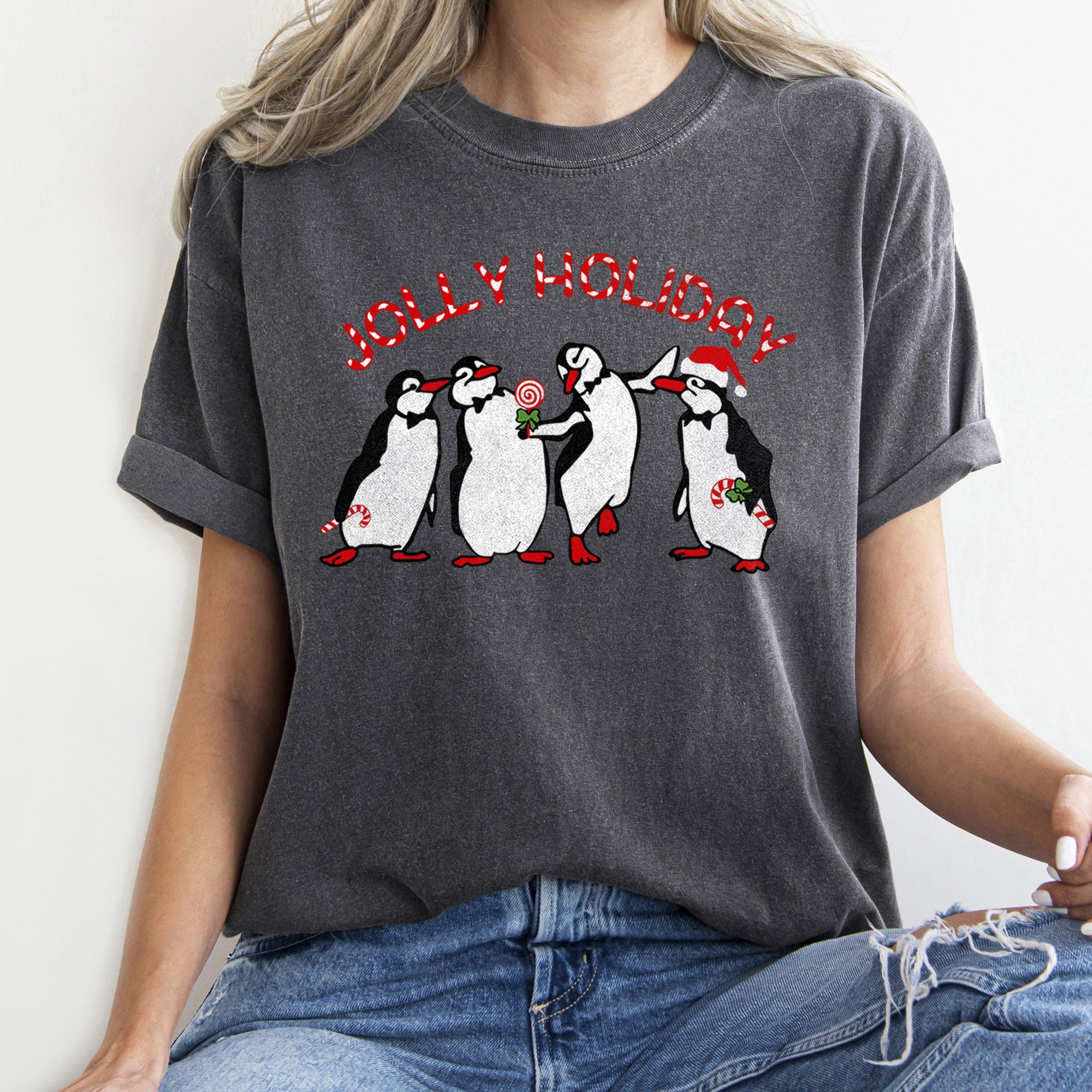 Jolly Holiday Penguins Christmas Parade In Cozy Winter Village Scene With Snowflakes And Cheer Comfort Colors Tee