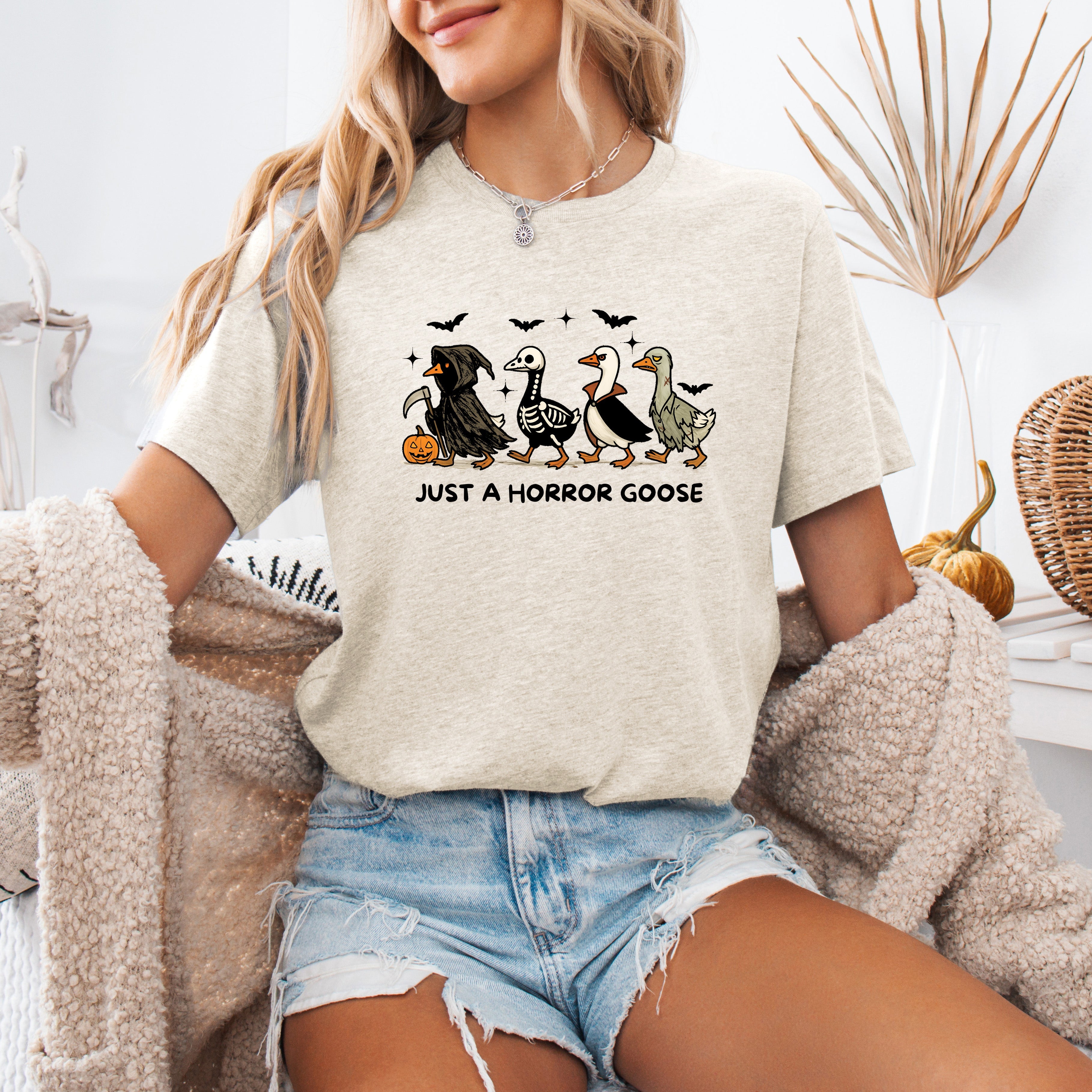 Just A Horror Goose Halloween Spooky Playful Creepy Quirky Festive Nighttime Chills Graphic Tee