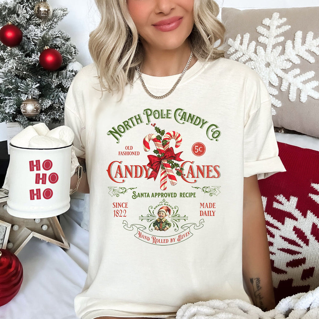 North Pole Candy Company Christmas Retro Sign Nostalgic Holiday Storefront Display Comfort Colors Tee