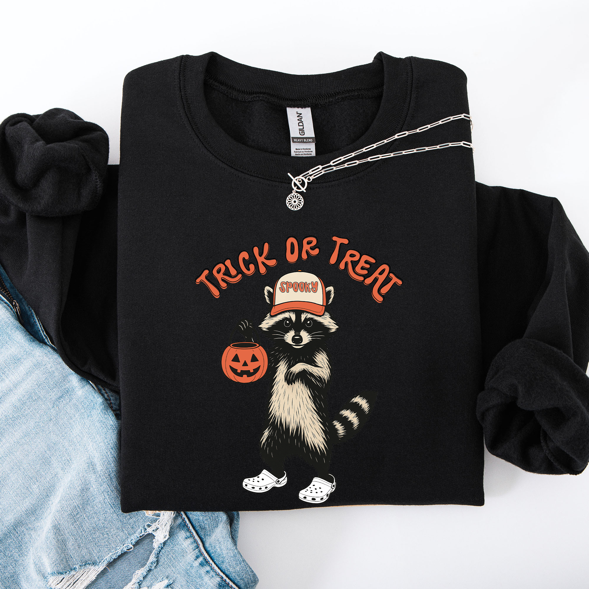 Raccoon Trick Or Treat Halloween Spooky Cozy Nighttime Autumn Theme Seasonal Fun Sweatshirt