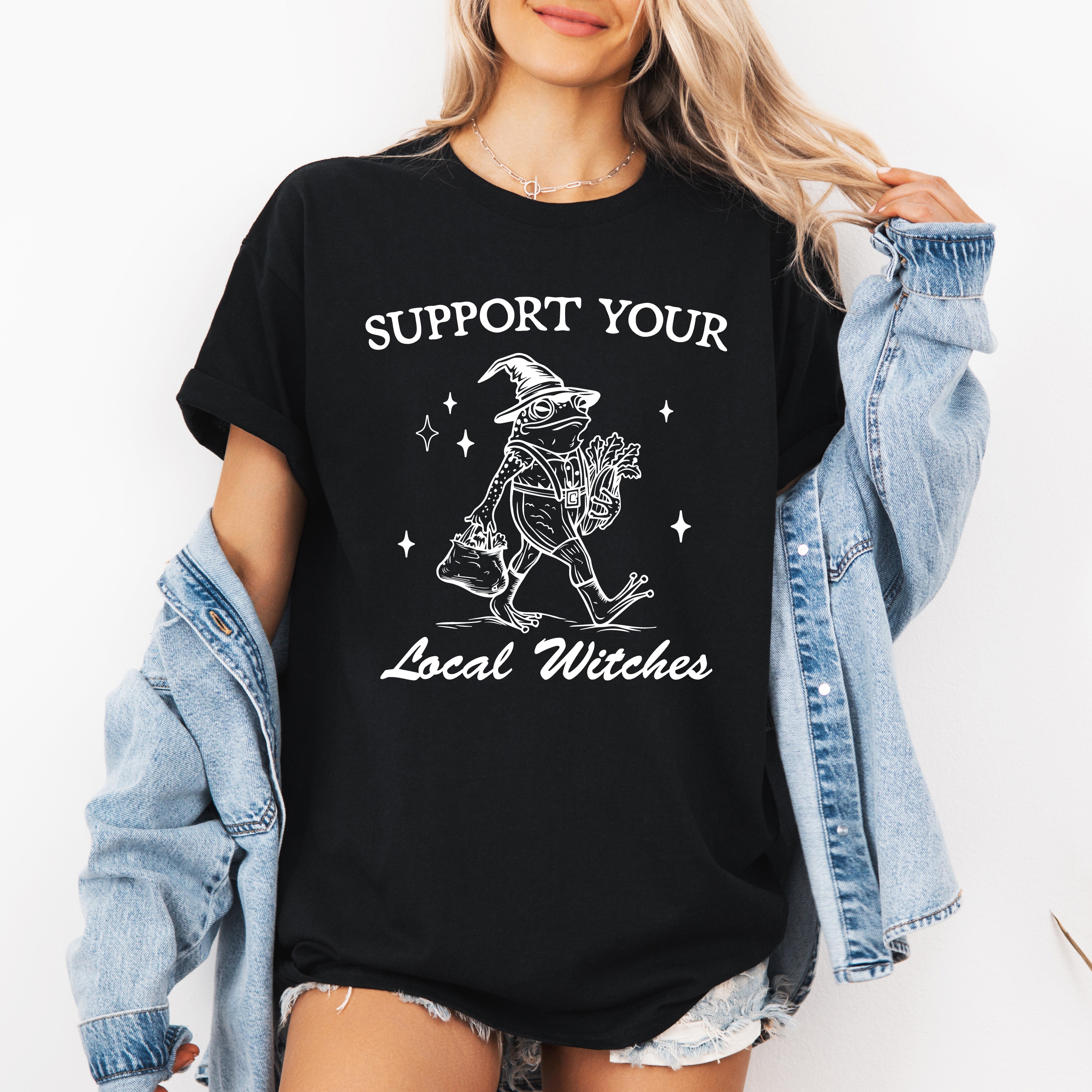 Support Your Local Witches Frog Halloween Witchy Spooky Nighttime Charm Graphic Tee