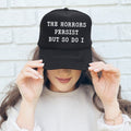 The Horrors Persist But So Do I Sassy Playful Bold Statement For The Brave Trucker Hat