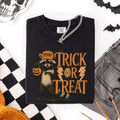 Trick or Treat Raccoon Halloween Mischief With Skeletons Ghosts Cats And Pumpkins Comfort Colors Tee