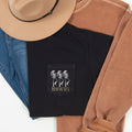 Howdy Skeletons Leopard Halloween Pocket Print With Western Style Skeletons In Leopard Spots At Dusk Comfort Colors Tee
