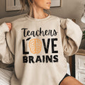 Teachers Love Brains Vintage Halloween Theme For Educators Official Edition Graphic Sweatshirt